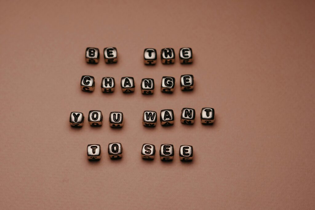 Beads with Letters Lying on a Pink Background