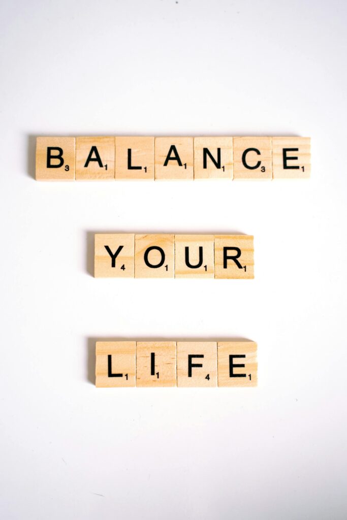 pexels-photo-6230967-6230967 Motivational quote 'Balance Your Life' spelled with Scrabble tiles on white background.