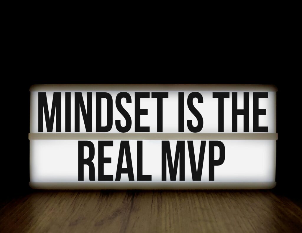 Motivational message 'Mindset is the Real MVP' displayed on a lightbox with black background.